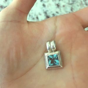 Sterling silver pendant with a blue stone